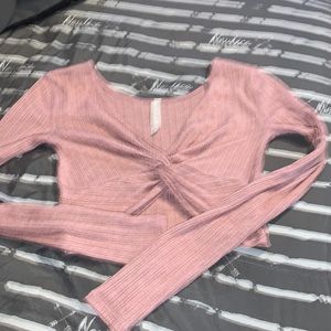 pink crop top with long sleeves